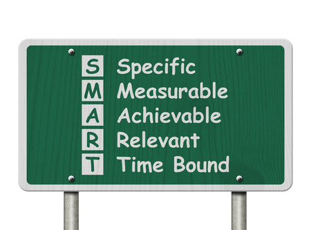Writing your SMART Goals,  A green Road Sign with the SMART Goals listed isolated on a white backgroundの写真素材