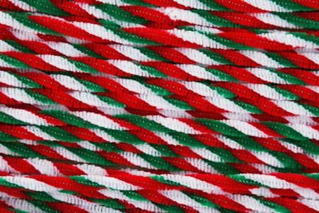 Red, white and green candy cane pipes Christmas background