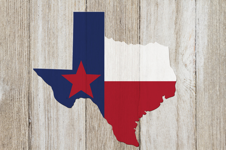 Map of Texas with the Texas Flag colors on weathered wood backgroundの写真素材