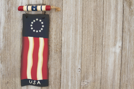 Retro patriotic USA background, USA patriotic old flag on a weathered wood background with copy spaceの写真素材