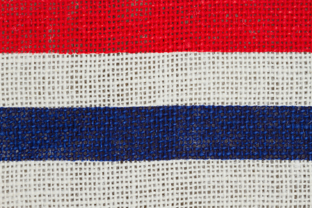 USA red and blue strips on burlap backgroundの写真素材