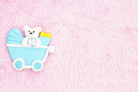 Old fashion pink baby background with a baby carriageの写真素材