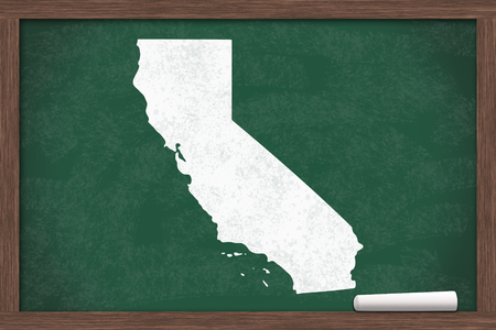 Learning about the state of California USA, a map of the state of California on a chalkboard with a piece of chalkの写真素材