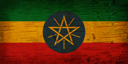 A rustic old Ethiopia flag on weathered wood for a backgroundの写真素材
