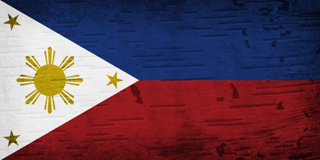 A rustic old Philippines flag on weathered wood for a backgroundの写真素材