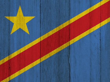 A rustic old Congo flag on weathered wood for a backgroundの写真素材