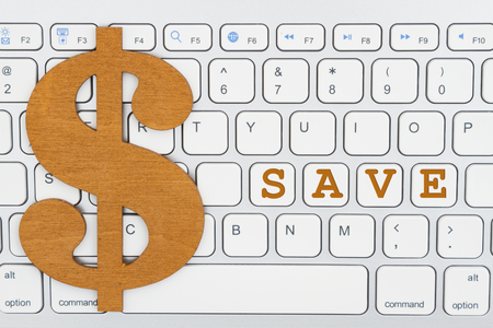 Save with dollar sign on a computer keyboard for ways to save money onlineの写真素材