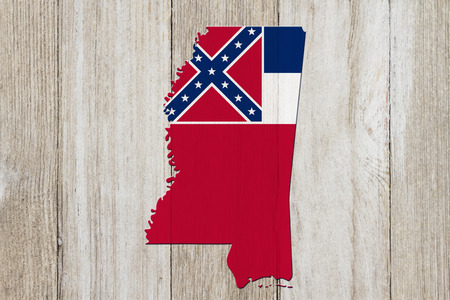 Map of Mississippi in the Mississippi flag colors on weathered woodの写真素材