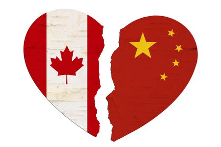 Canadian and Chinese flags in a broken heart isolated over whiteの写真素材