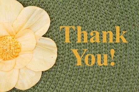 Thank you message with a flower on olive green textured concentric circle fabric materialの写真素材