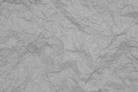 Gray textured wrinkled paper material for a background or texture for your images or textの写真素材