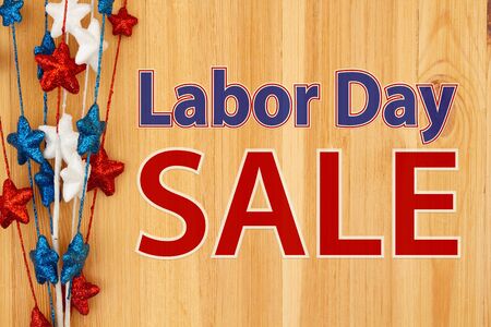 Labor Day Sale type message with red, white and blue stars on woodの写真素材