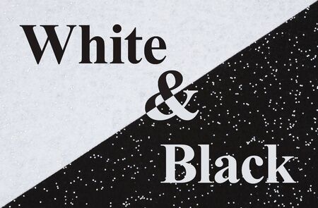 Black and white type message on black and white felt material that is split in halfの写真素材