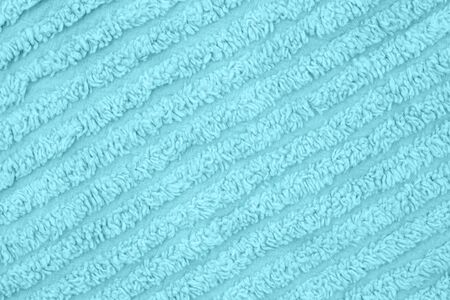 Pale teal plush lined fabric background with copy space for message or use as a texture