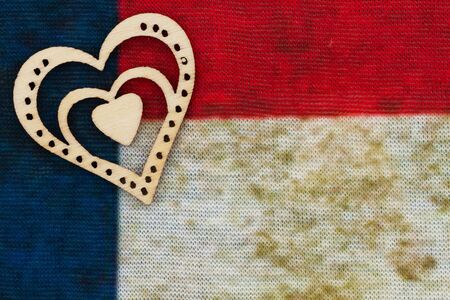 Red, white and blue grunge knit textured weave with heart material background with copy space for American messageの写真素材