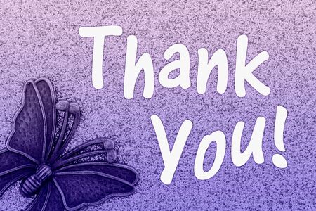Thank You word message with metal butterfly with purple glitter paperの写真素材