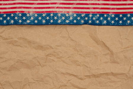 Retro USA stars and stripes burlap ribbon on butcher paper background with copy space for your American messageの写真素材