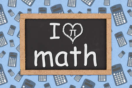 I love math word message on a grunge chalkboard sign with calculatorの写真素材