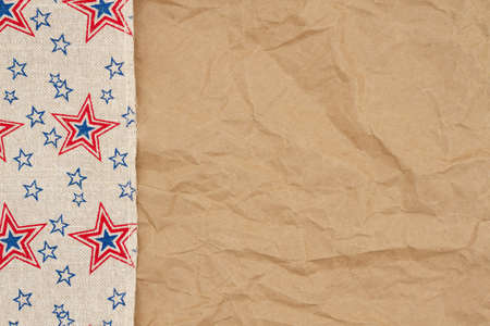 Retro USA star burlap ribbon on butcher paper background with copy space for your American message