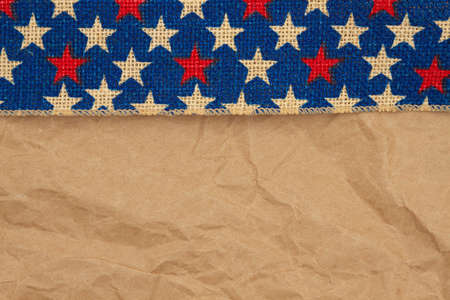 Retro USA star burlap ribbon on butcher paper background with copy space for your American messageの写真素材