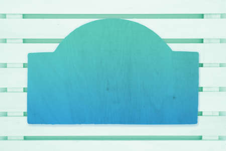 Wood sign in pale green wood slats board background with copy space for your summer message