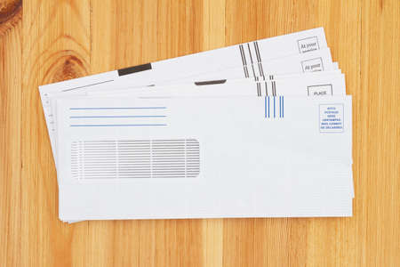 Blank business envelopes on a wood desk mockup for your message