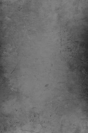 Silver distressed metal grunge textured material background with copy space for message or use as a textureの写真素材