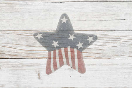 Old star American flag on weathered whitewash wood with copy space for your United States messageの写真素材