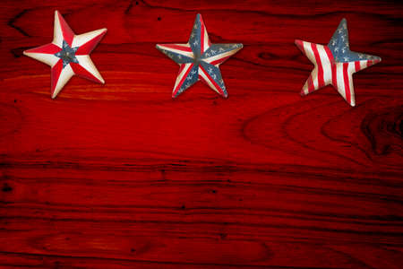 Retro American patriotic background with grunge USA flag stars on red wood with copy space for your...
