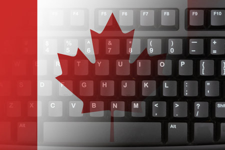 The internet in the Canada with the Canadian flag on a black keyboardの写真素材