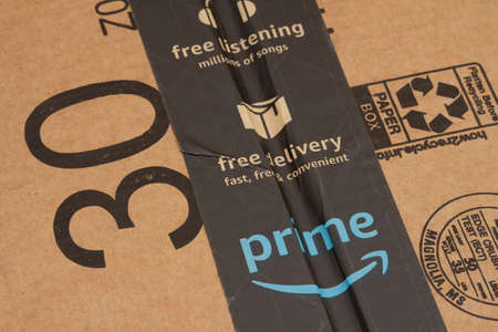 Greenville SC, USA May 2021. Illustrative editorial of an Amazon packaging box with prime tape advertising free deliveryのeditorial素材