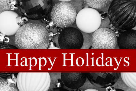 Happy Holidays greeting card with black and white ball ornamentsの写真素材