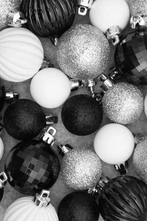 Christmas background with black and white ball ornaments with copy space for your Christmas messageの写真素材