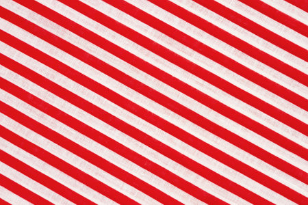 Red and white candy cane striped material Christmas holiday backgroundの写真素材