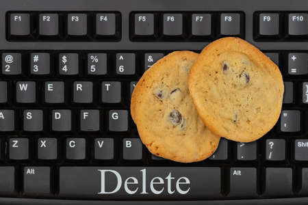 Delete internet web browser metaphor with a keyboard and chocolate chip cookies