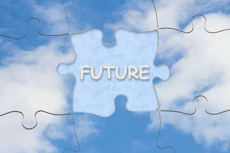 Understanding your future concept with puzzle pieces and blue sky with cloudsの写真素材