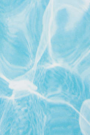 Blue with soft white swirls material textured background for a backdrop or use as a texture