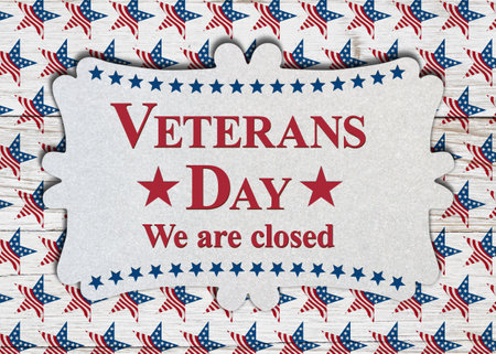Closed Veterans Day sign with red, white, and blue US flag stars on weathered woodの写真素材