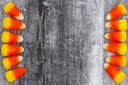 Candy corn Halloween background with weathered wood for you candy of holiday message