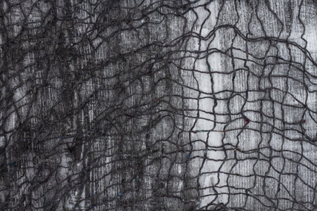 Black creepy cloth textured background or used as a texture