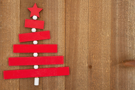 Christmas tree on weathered wood holiday background for your winter or seasonal messageの写真素材
