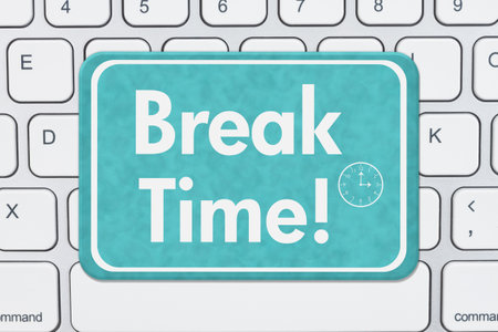 Break Time message on a blue sign on a gray computer keyboard for time to take a break from screen time messageの写真素材
