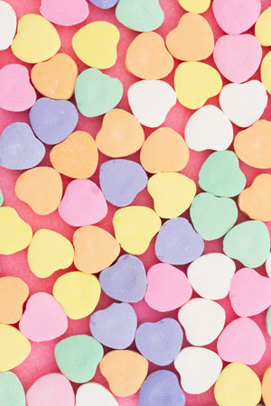 Lots of candy hearts love background for your romance or dating messageの写真素材