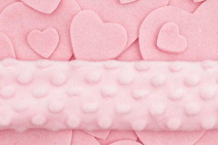Lots of pink felt hearts with plush banner love background for your romance or dating messageの写真素材