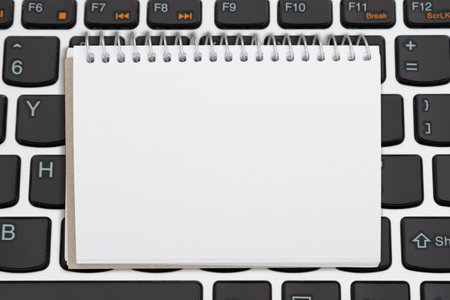 Blank notepad on a computer keyboard for your online shopping messageの写真素材