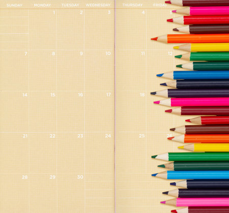 Color pencil crayons on monthly calendar paper for you education or school messageの写真素材