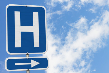 Hospital highway road sign with skyの写真素材