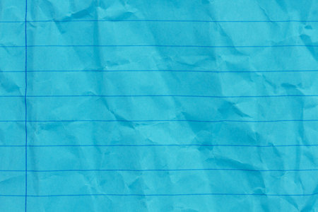 Retro blue lined school crumpled paper background with copy space for your school messageの写真素材