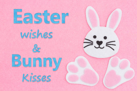 Happy Easter greeting wish with Easter bunny rabbit on pink felt