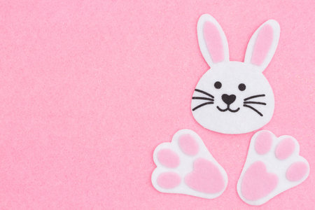 Easter bunny rabbit background on pink felt fabric